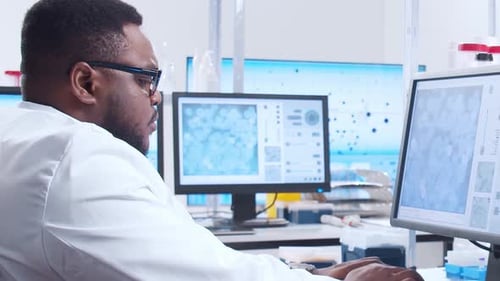 Scientist Analyzing Data in a Brightly Lit Lab