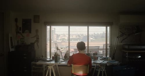 Artist Diligently Works at Her Desk Drawing and Working on an Illustrated