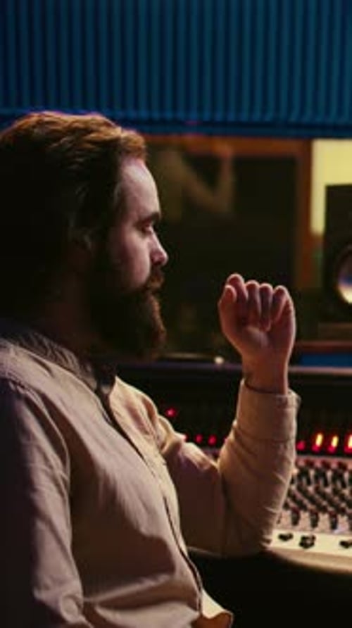 Vertical Video Tracking Engineer Used Audio Mixer in Professional Recording Studio