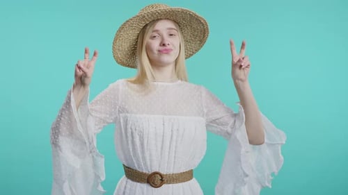 Woman in White Dress Posing with Peace Sign