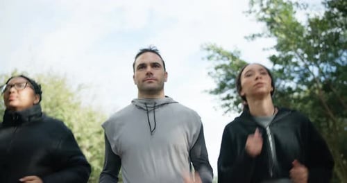 Fitness, forest and group of friends running together for outdoor exercise