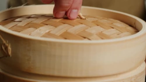 Steaming Vegetables Closeup Wooden Steamer for cookingThe Concept of Food and Healthy Eating Yellow