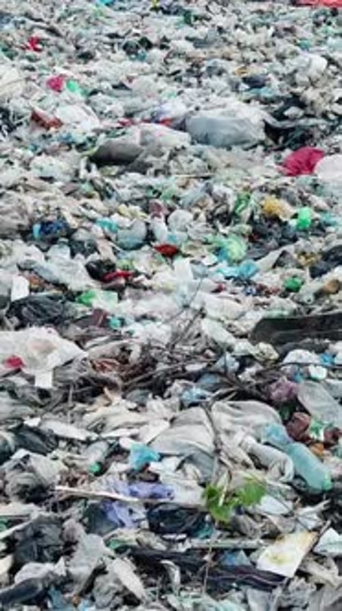 Vertical Video A Closeup of a Pile of Garbage at a Landfill
