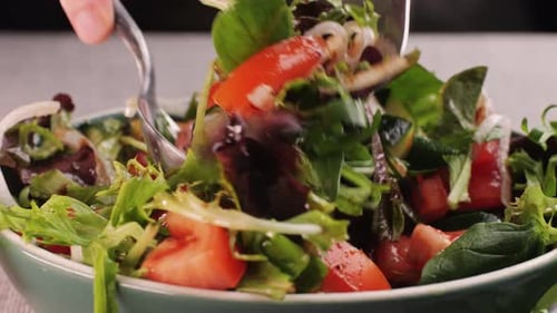 Pouring Olive Oil on Healthy Fresh Vegetables Vegan Salad Close Up Delicious Diet Salad of Tomato