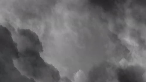 Dark Storm Clouds Swirling across Gray Sky