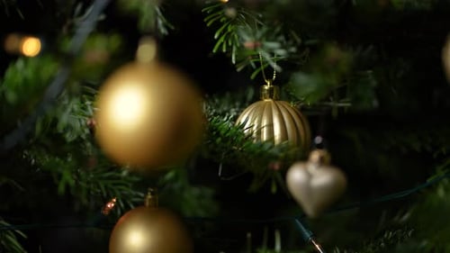 Christmas Tree with Gold Ornaments and Lights