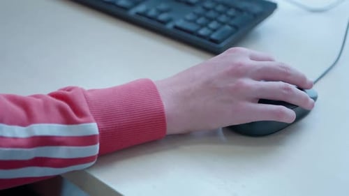 teenager hand using mouse