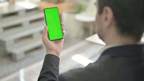Businessman Using Phone with Green Chroma Screen
