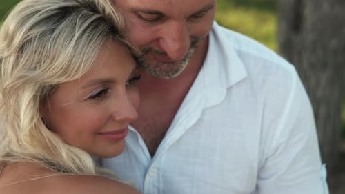 Affectionate Couple Embracing in a Natural Setting