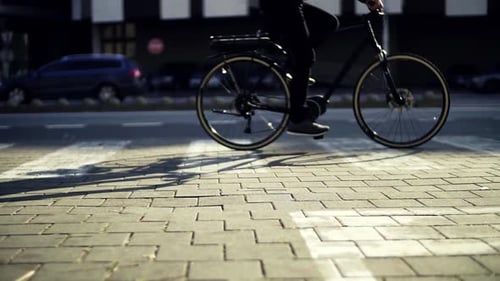 Midsection of Male Cyclist Cycling on an Electrobike in City