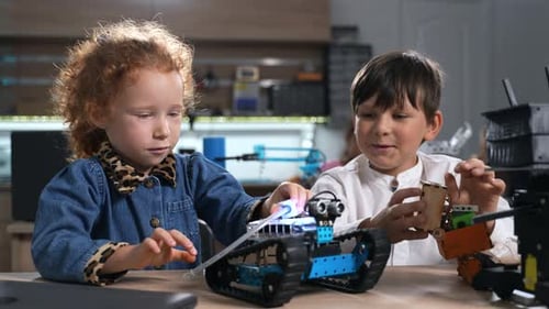 Elementary Students Assembling Robotics at School