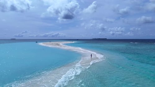A girl enjoys the beauty of a tropical island in the ocean