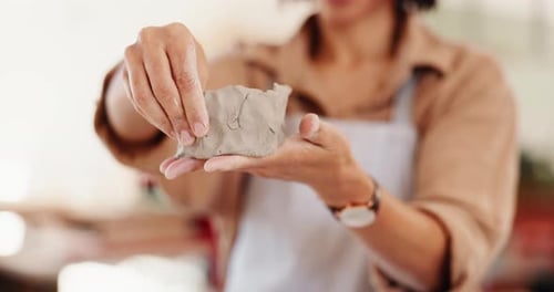 Hands, person and molding clay at pottery workshop for artistic process, sculpture design and shape