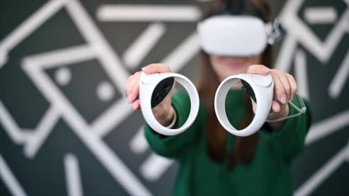 Young Woman Playing Virtual Reality Game with Headset