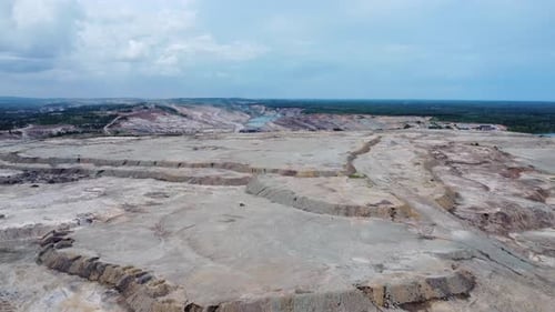 Coal mining surrounded by oil palm plantations looks very barren