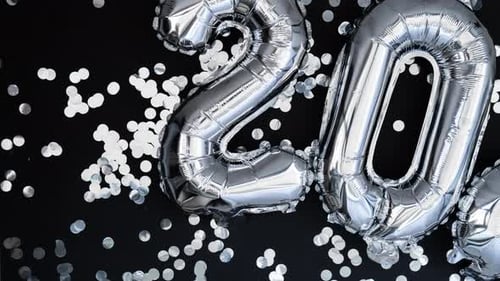 Stop Motion Happy New Year 2024 Metallic Balloons with Confetti on Dark Black Background Greeting