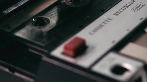 Portable compact cassette tape recorder rewinding in action CLOSE-UP