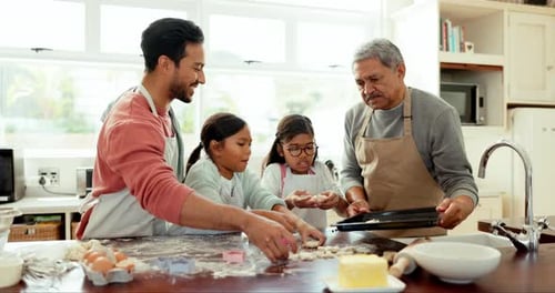 Family Baking Cookies Together in Bright Kitchen