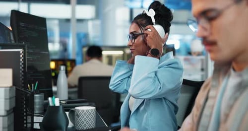 Computer, headphones and smile of programmer woman at desk in office for coworking