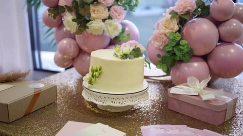 Celebratory Cake with Flowers and Gift Boxes