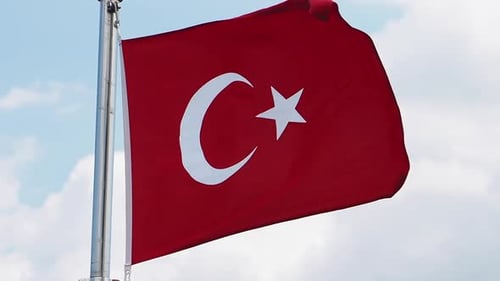 Turkish Flag Waving in a Blue Sky