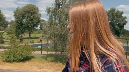 a young girl walks through the city in the summer, drinks a cold tasty cocktail on the street reacts