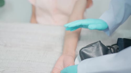 Doctor Measuring a Patient's Blood Pressure