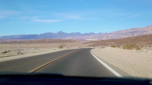 Car Driving On The Road At Death Valley National Park In California, USA. POV