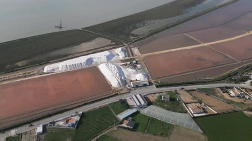 Salt piles and shallow extraction lakes, aerial view