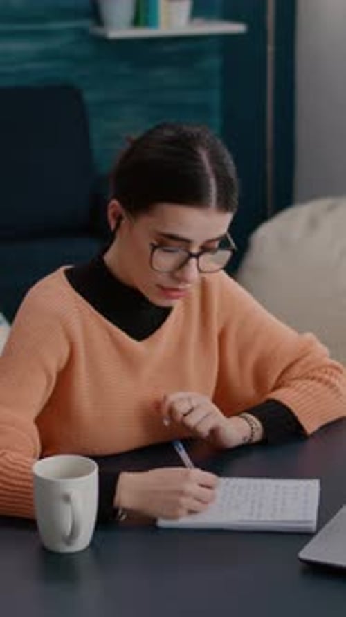 Young Adult Working From Home, Taking Notes