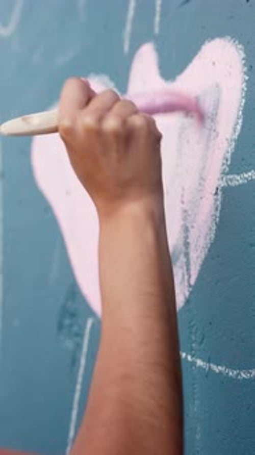 Person, hands and artist with stroke on wall art for floral design, colorful creativity