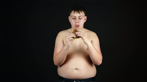 Young Adult Enjoying a Burger