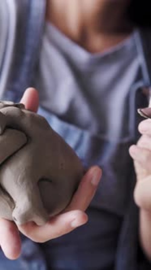 Pottery wheel, Hands work on ceramic clay workshop store. Small business. Vertical video