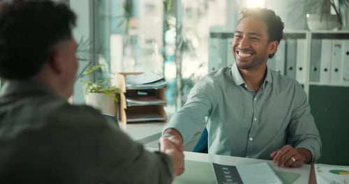 Man, interview and shaking hands with resume at office with smile, review