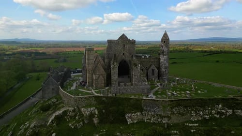 Aerial view of the Rock of Cashel, capturing ancient stone walls, round towers, and cathedral ruins