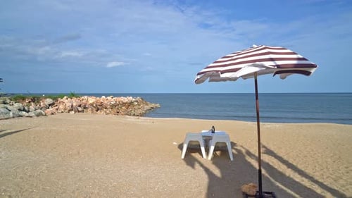 empty patio outdoor table and chair on beach with sea beach background