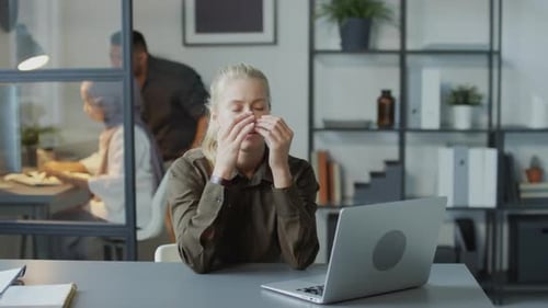 Stressed Woman At Work In Office