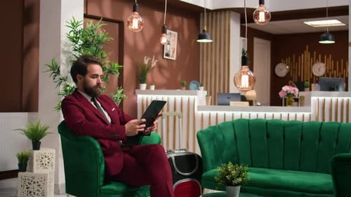 Business Associate Reads Files on Tablet