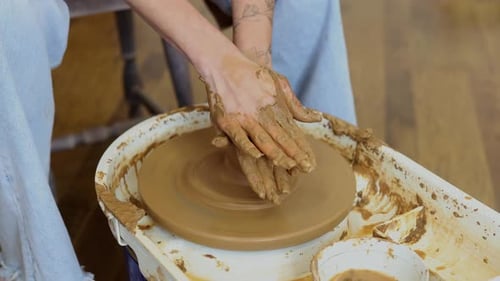 Close Up of Female Hands Shaping Clay on Pottery Wheel in Ceramic Studio Handmade Pottery Process