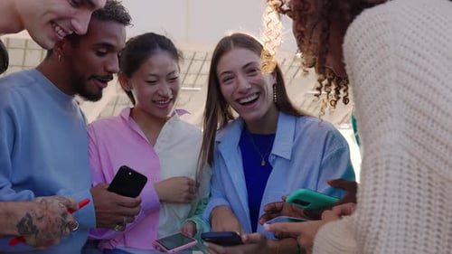 Friends Using Phones in an Urban Setting