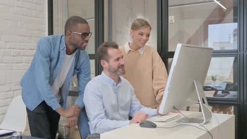 Happy Coworkers Making Video Call Together at Work