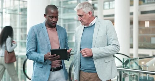 Collaboration, tablet and businessmen in the office in discussion for planning project together