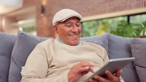 Senior Man Using Tablet, Relaxing on Couch