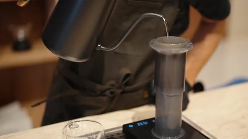 Close Up of Barista Preparing Coffee Drink