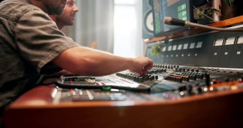 Studio, hands and producer with music equipment for volume level, frequency mode and control