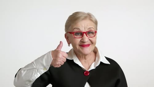 Happy Elegant Old Woman in Spectacles Showing Thumb Up White Background Studio