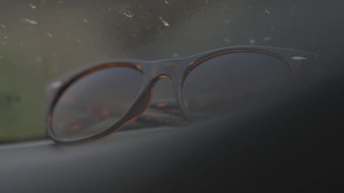 Close-Up of Stylish Sunglasses on Dark Surface