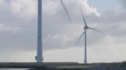 Wind Turbines Spinning on Cloudy Day