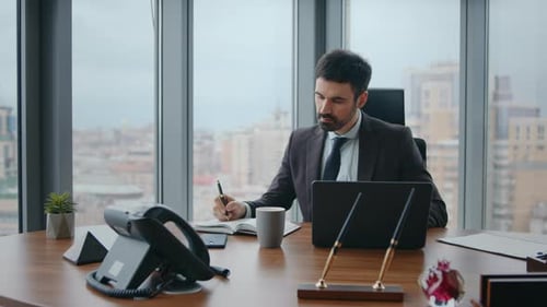 Pensive Manager Making Notes Working By Laptop Closeup Ceo Writing Ideas Office