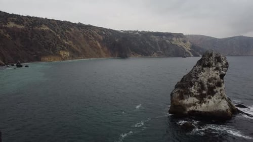 Aerial View on Calm Azure Sea and Volcanic Rocky Shores Small Waves on Water Surface Nature Summer
